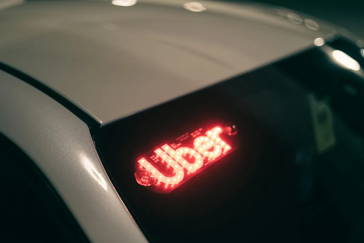 a close up of a car with a red light on it