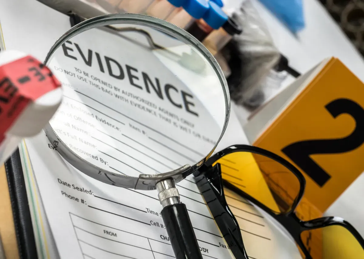 a close up of a magnifying glass on a table with a book-2