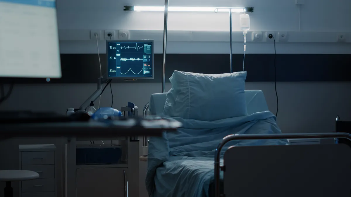  a hospital bed with a monitor and a monitor on it