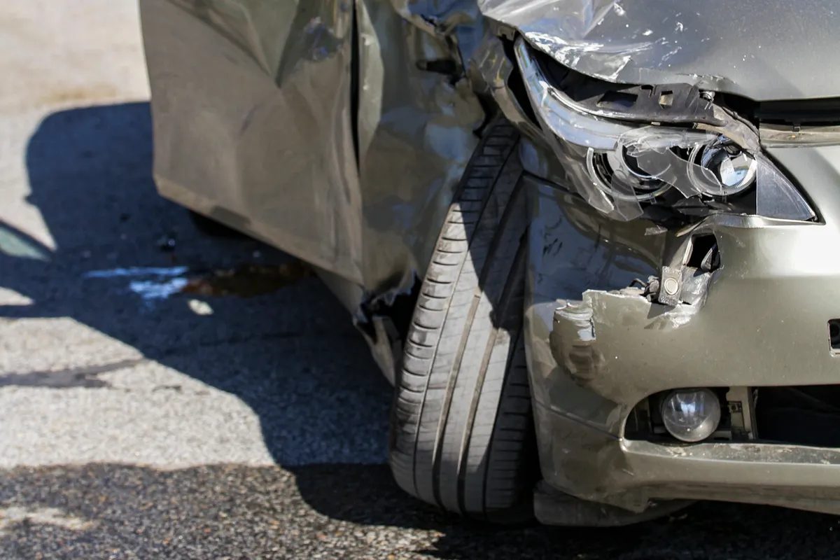 arafed car with a denting front bumper and a damaged front bumper