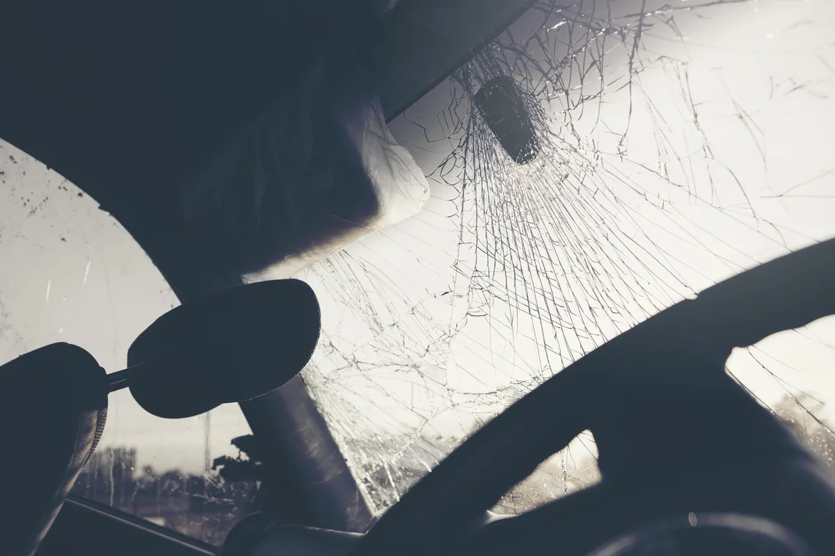 arafed windshield of a car with a broken windshield